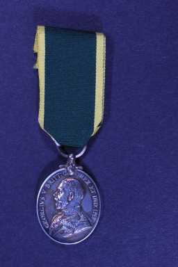 Territorial Efficiency Medal - 7782395 SJT. J.W. HOLLAND. R.A