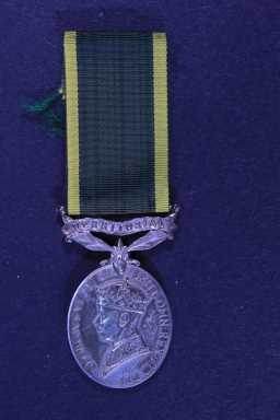Territorial Efficiency Medal - 4447852 W.O.CL.2 W.H. HARPER. 