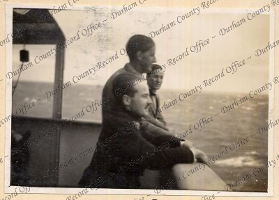 Photograph of three men [possibly offic...