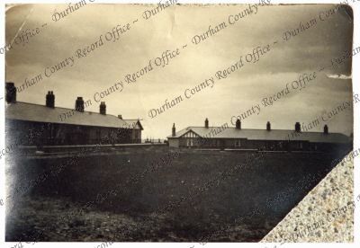 Photograph of a group of miners' cottage... Photograph of a group of miners' cottage...
