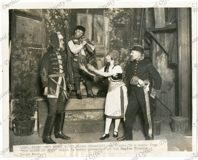 Photograph of a group of actors performi... Photograph of a group of actors performi...