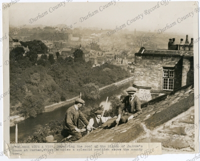 Photograph of three workmen on the roof ... Photograph of three workmen on the roof ...