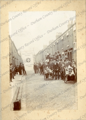 Photograph of a group of people with two... Photograph of a group of people with two...