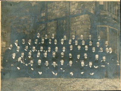 Photograph of staff and students, n.d. [1906-1908]
Includes  back row: 1 - [R.W.]Edmonds, 3 Joe [H.] Lowe (Education Officer in army), 4 [M.] Hopper, 5 Jack Wilson, 6 T.[A.] English (deceased, taught