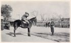 Photograph of Major Heslop, 1st Battalion, The Durham Light Infantry, on a horse, taking the salute during a battalion route march, taken at Shanghai, China, c.1938