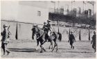 Photograph of two officers, on horses, and soldiers of the 1st Battalion, The Durham Light Infantry, on a route march, taken at Shanghai, China, c.1938