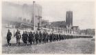 Photograph of soldiers of the 1st Battalion, The Durham Light Infantry, returning to barracks at the completion of a route march, taken at Shanghai, China, c.1938