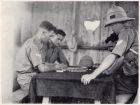 Photograph of soldiers of the 1st Battalion, The Durham Light Infantry, playing mah-jongg [possibly while on outpost duty], taken at Shanghai, China, c.1938