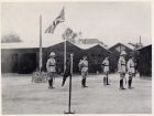 Photograph of Major-General A.P.D. Telfer-Smollet, Commander-in-Chief of the International Garrison in Shanghai, right, and unidentified officers, standing on a parade ground during an annual inspecti