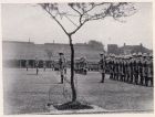 Photograph of soldiers of the 1st Battalion, The Durham Light Infantry, on a parade ground, during an annual inspection by Major-General A.P.D. Telfer-Smollet, Commander-in-Chief of the International 