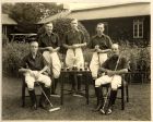 Photograph of a polo team of the 1st Battalion, The Durham Light Infantry, comprising 'Luard', left, seated, 'Simpson', second left, standing, Major R.B. Humphreys, centre, standing, 'Fanning-Evans', 