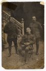 Photograph of Private William Harrington, left, and Sergeant Rex Smith, interpreter, and a Sergeant of the King's Own Yorkshire Light Infantry, taken at Arras, France, 1 May 1916