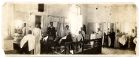 Photograph of interior of the Mustapha hairdressing salon, with customers and employees, Alexandria, Egypt, n.d., [1928]