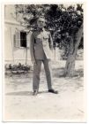 Photograph of a soldier of 1st Battalion, The Durham Light Infantry, possibly W. Lambeth, in front of Area Headquarters building, Alexandria, Egypt, November 1928