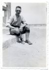 Photograph of soldier, possibly W. Lambeth, [The Durham Light Infantry] seated on step, Alexandria, Egypt, 1928