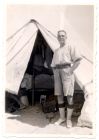 Photograph of soldier standing in front of tent, Sidi Bish[ ]r, Egypt, 1928