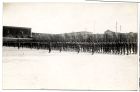 Photograph of soldiers on parade inside an unidentified barracks, firing a volley, possibly in Egypt, n.d., c. 1928 - 1930
