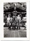 Photograph of five soldiers in a mess hall with Christmas decorations, n.d., 1920s