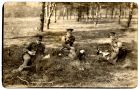 Photograph of three Durham Light Infantry officers taking refreshments in wooded countryside, n.d., [1920s]