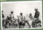 Photograph of a group of soldiers on donkeys, captioned An informal group [12], c.1938