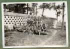 Photograph of a group of soldiers, captioned Near the wall of an old temple [13], April 1939