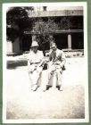 Photograph of two men [possibly H.C.R. Lees], captioned With the pup and Mac [29], c.1939
