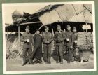 Photograph of five soldiers of the 1st Battalion, The Durham Light Infantry, [possibly including H.C.R. Lees] with a Chinese man, captioned With some of my section at the ¿S¿ post [30], 7 January 1938