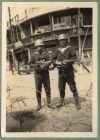 Photograph of two Chinese soldiers, captioned Two friendly faces comrades Mussolini and Hore Belisha [34], c.1938