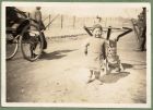 Photograph of a small child, captioned The new recruit no mans land across the wire [41], c.1939