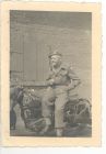 Photograph of Battery Sergeant-Major Stanley Levitt, 113 Light Anti-Aircraft Regiment, Royal Artillery (Territorial Army), sitting on a motorcycle, taken at Hanover, Germany, August 1945