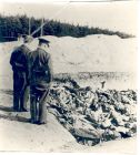 Photograph of an open mass grave at Belsen concentration camp, Germany, [April - May] 1945