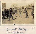Photograph of soldiers of the 6th Battalion The Durham Light Infantry training at their billets in Bensham, Gateshead, captioned: Bayonet Fighting, Second Lieutenant Favell, n.d. [1914 - 1915]