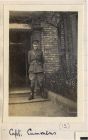 Photograph of an officer outside his billet captioned: Capt. Cummins, 'A' Company, 6th Battalion The Durham Light Infantry, n.d. [1914 - 1915]