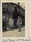 Photograph of two officers of the 6th Battalion The Durham Light Infantry outside their billets, captioned: Lieut. Thorpe & 2nd Lieutenant Badcock of 'A' Coy and 'B' Coy respectively, n.d. [1914 - 191