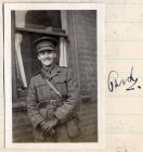 Photograph of Second Lieutenant P.H.B. Lyon, 'D' Company, 6th Battalion The Durham Light Infantry outside his billet, and autograph, n.d. [1914 - 1915]