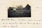 Photograph of damaged farm buildings, captioned: Zevenkote Farm - this farm which was used as an ammunition store was blown up by a shell on May 1st, Belgium, n.d. [1915]