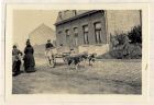 Photograph of Belgian civilians and a dog cart in a village street, Belgium, n.d. [1915]