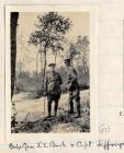 Photograph of two officers talking in wooded terrain, captioned: Brig.-Gen. J.E. Bush and Capt. Jeffreys, Belgium, n.d. [1915]