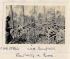 Photograph of senior non-commissioned officers of the 6th Battalion The Durham Light Infantry constructing a dug-out in woodland, captioned: C.S.M. McNair, C.S.M. Bousfield, building a home, Belgium, 
