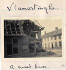 Photograph of a shell-damaged house, captioned: Valmertinghe - A Ruined House, Belgium, n.d. [June 1915]