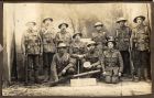 Photograph of Lieutenant H. McBain and No. 13 Platoon Lewis Gun Team posing with the Lewis Light Machine Gun, Le Brebis, France, 1917 
Back row: Lieutenant Corporal Coyne, Private Hinton, Private Bak