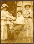 Photograph of Mrs. Yeoman, seated, and a young boy called Willie, with two other young women, Brixton, Surrey, August 1917