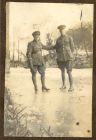 Photograph of Lieutenant Peacock and Hubert McBain ice-skating near the Schloss, Lechenich, Germany, January 1919