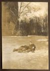 Photograph of Lieutenant Pratt and Lieutenant Arderne (D.L.I.) taking a tumble while ice skating on the moat of the Schloss, Lechenich, Germany, January 1919