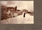 Photograph of May McBain standing in snow with Murrie Church in the background, India, n.d. [1920s]