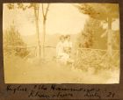 Photograph of Hughie McBain with children from the Hammond family in a garden, Khanspur, India, July 1921
