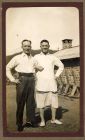 Photograph of an unidentified soldier and George Pinkney, right, in informal dress in camp, captioned: Monday, bath day, Razmak, North West Frontier Province, India, 6 October 1930