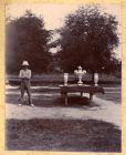 Photograph of an officer of the 2nd Battalion The Durham Light Infantry standing beside a table of polo trophies, probably taken in Burma, n.d. [1899]