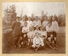 Group photograph of the D.W.E.H.C. [possibly Durham Workers' Educational Hockey Club] hockey team, taken on a playing field south of Durham Cathedral, Durham City, n.d. [early 20th c.]