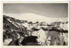 Photograph of snow covered mountains, with a truck, probably North Africa, 1940 - 1943